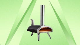 The Ooni Fyra 12 pizza oven is displayed against a green background.