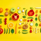 A display of produce against a yellow background