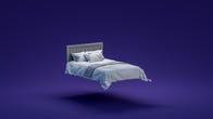 A mattress floating against a purple background