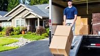 a person in a blue shirt unloads two boxes from a moving van with a hand truck